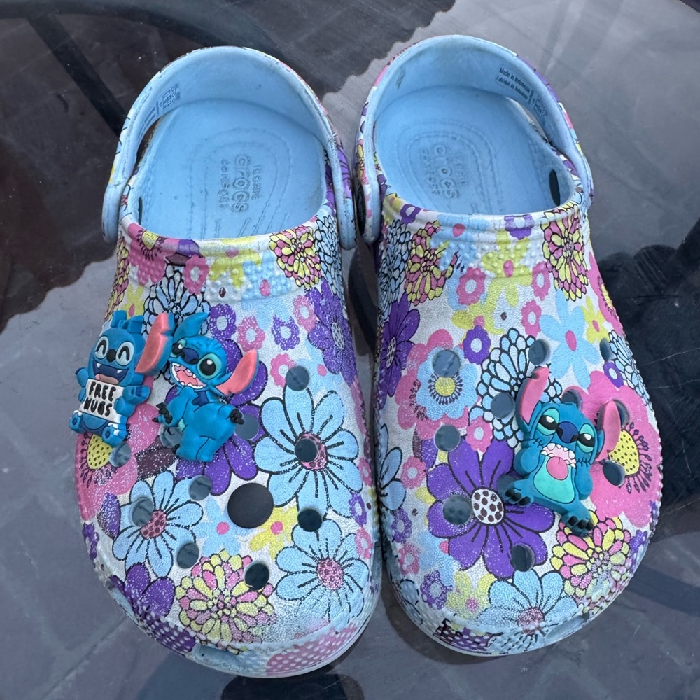 CROCS Blue and Pink Slippers with Whimsical Design